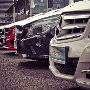 A row of Mercedes Benz in dealer parking lot